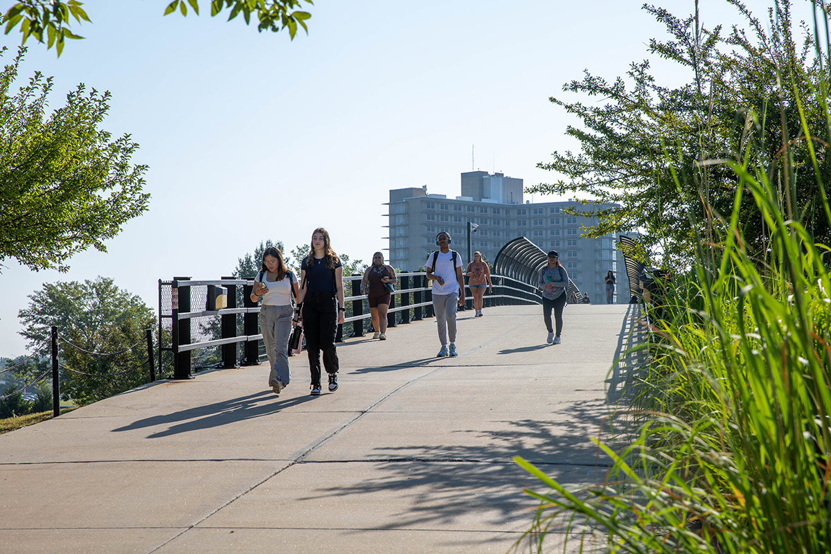 SIU Students walk across campus overpass